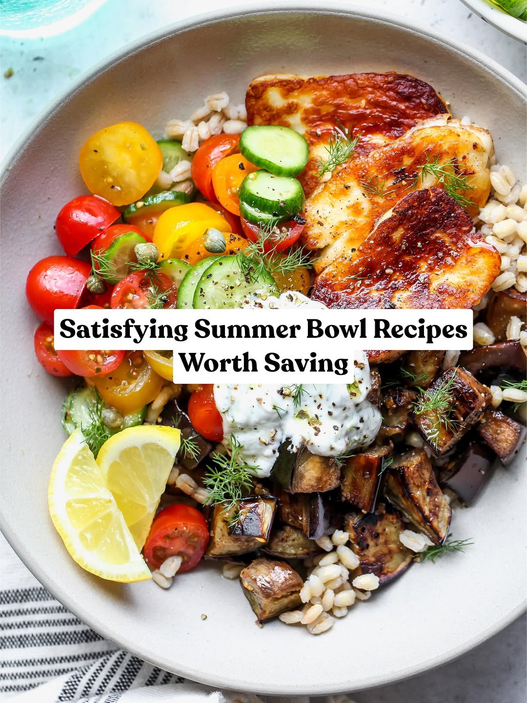 Mediterranean eggplant and halloumi bowl with a cucumber tomato salad.