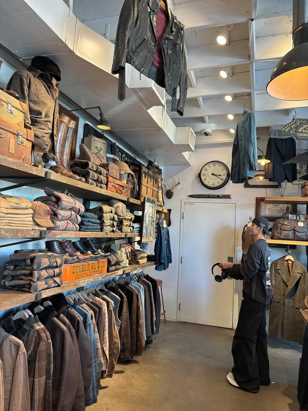 Photo by 도겸 on October 23, 2025. May be an image of rack, outerwear and hat shop.