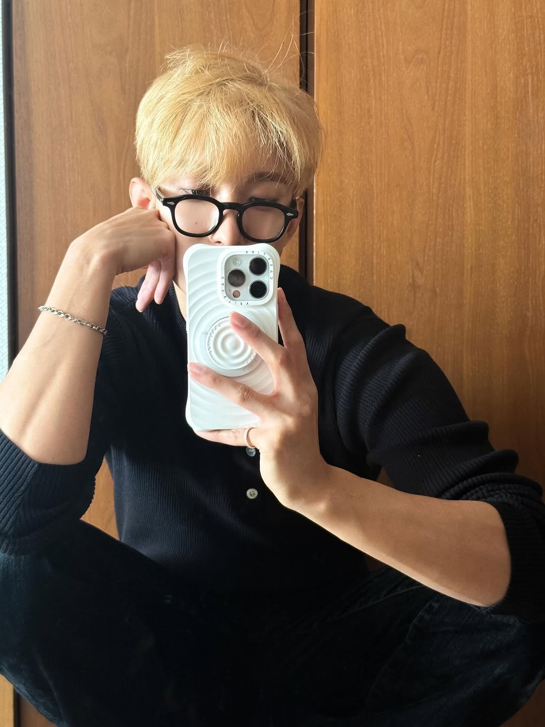 Photo by 도겸 on November 26, 2025. May be a selfie of one or more people, bangs, blonde hair, phone, eyeglasses, mirror and text.