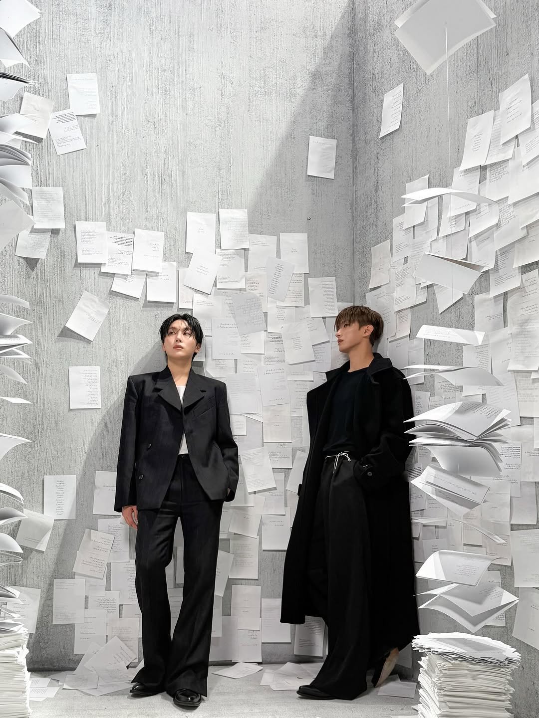 Photo by 도겸 on December 24, 2025. May be an image of overcoat, suit, poster and text.