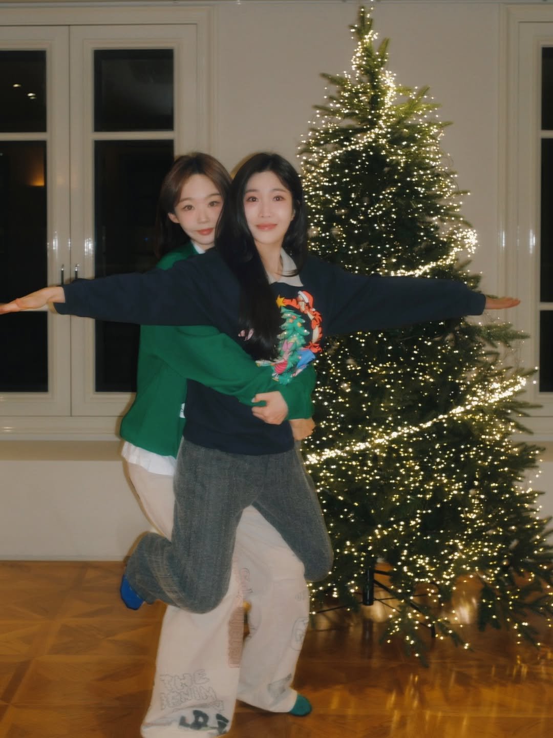 Photo shared by 강민경 (행동파) on December 22, 2025 tagging @dlgofl85. May be an image of christmas tree, sweater, tinsel, turtleneck and text.