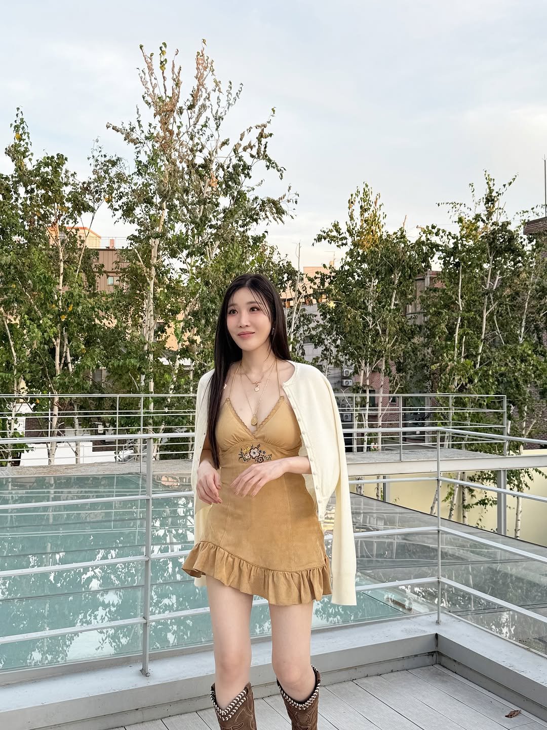 Photo by 이해리 on October 20, 2025. May be an image of slip, boots, poncho and text.