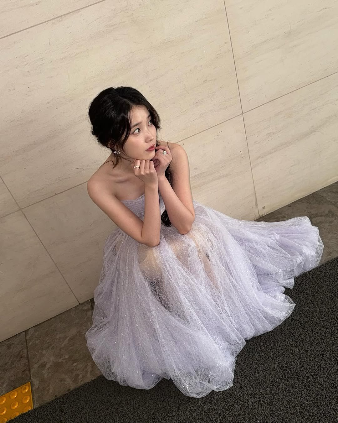 Photo by 이지금 IU on October 06, 2025. May be an image of 1 person, child, net, gown, dress and text.