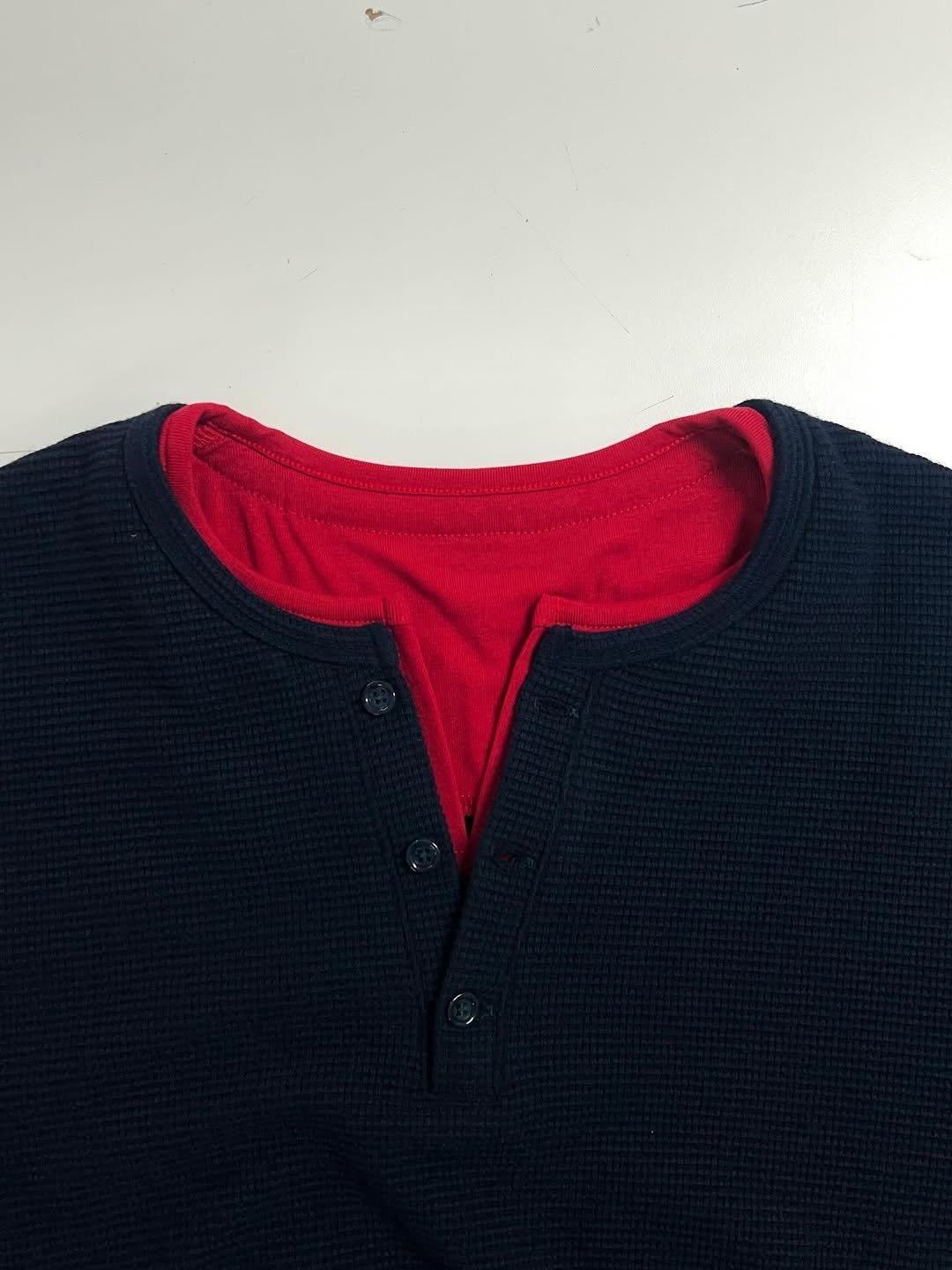 Photo by DNSR 디앤에스알 on April 22, 2026. May be an image of fleece, sweater, cardigan, knit and text.