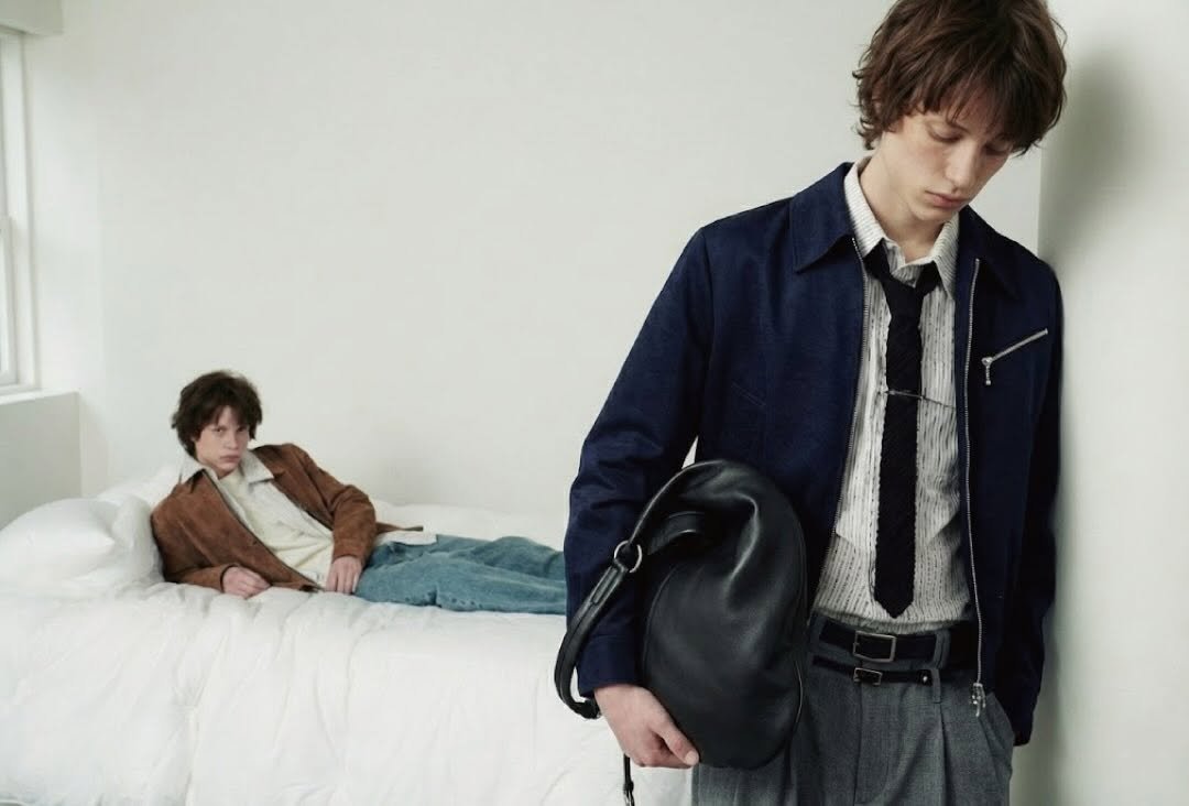 Photo by DNSR 디앤에스알 on February 19, 2026. May be an image of duffle coat, bolo tie, suit and text.