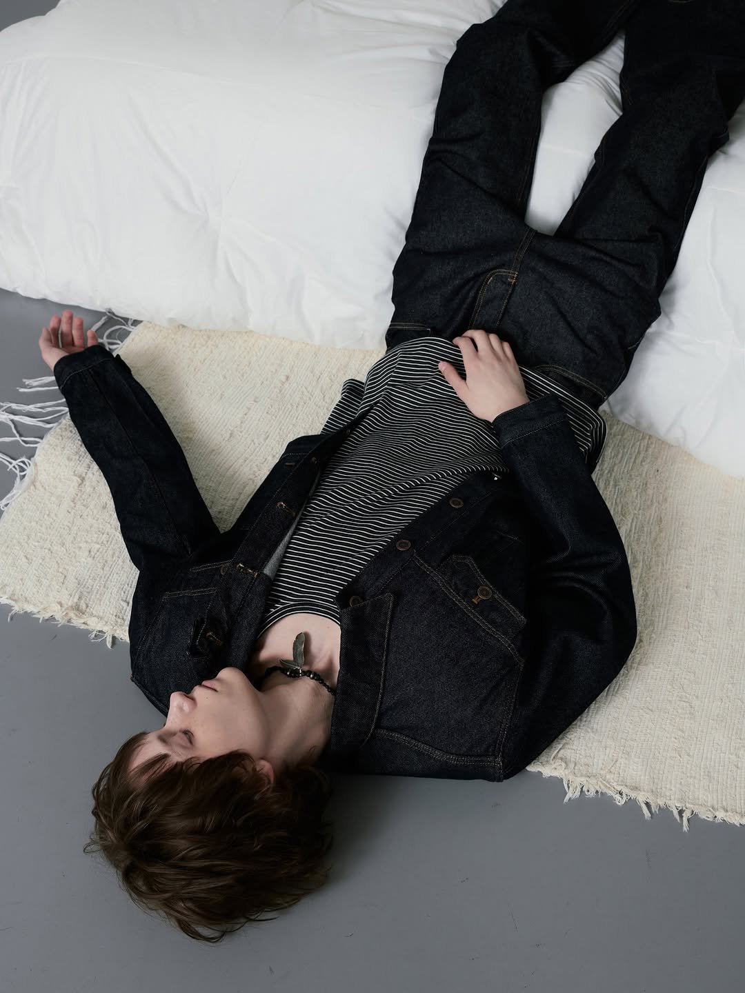 Photo by DNSR 디앤에스알 on February 13, 2026. May be an image of one or more people, makeup, bolo tie and text.