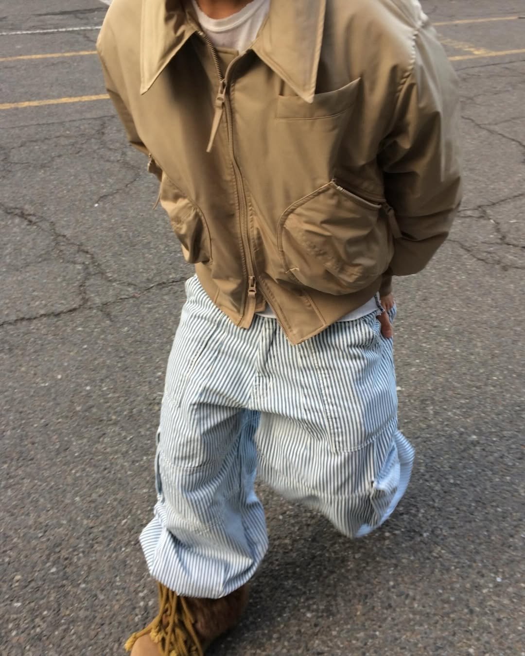 Photo by DNSR 디앤에스알 on December 22, 2025. May be an image of goosedown coat, jacket, parka, bandanna and text.