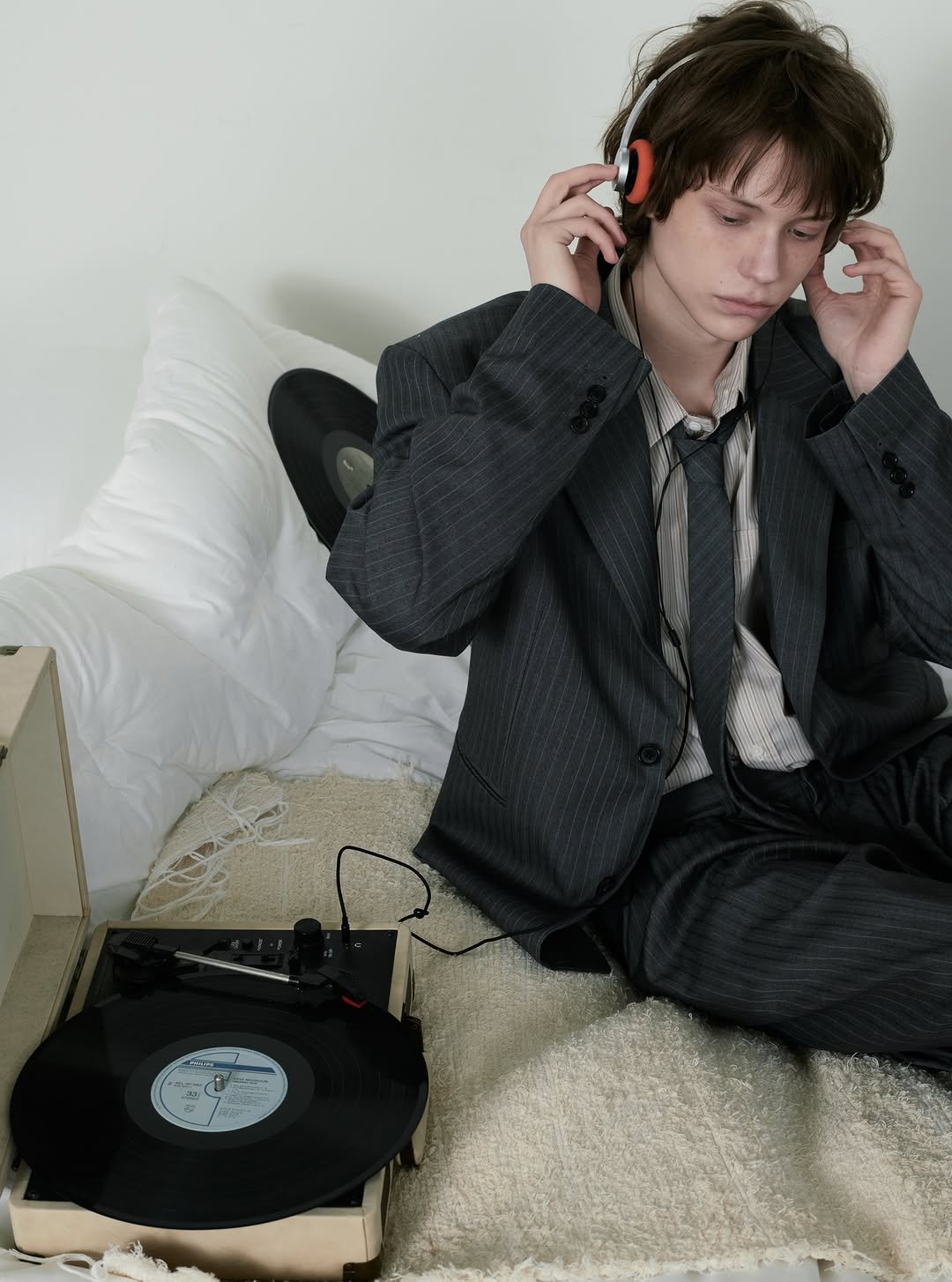 Photo by DNSR 디앤에스알 on February 12, 2026. May be an image of phone, telephone, portable cassette player, bolo tie and text.