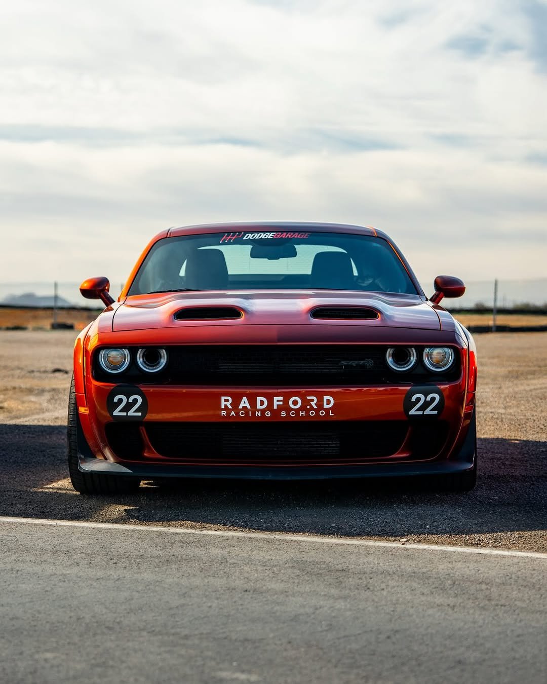 Photo shared by Dodge on April 17, 2026 tagging @radfordracingschool. May be an image of racing vehicles, race car, wheel, blower, road and text.