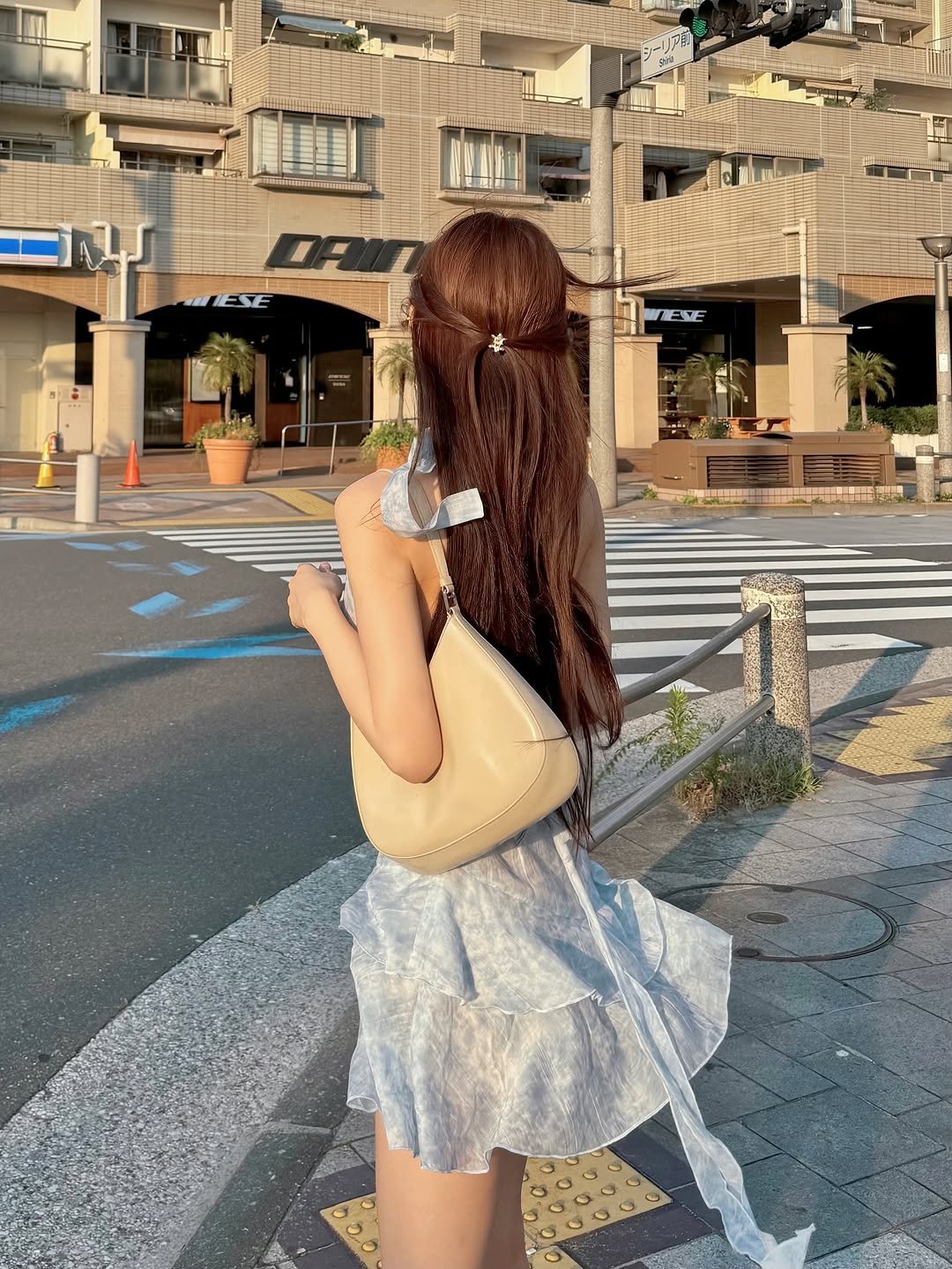 Photo by 김도연 on July 29, 2025. May be an image of 1 person, miniskirt, street and text.