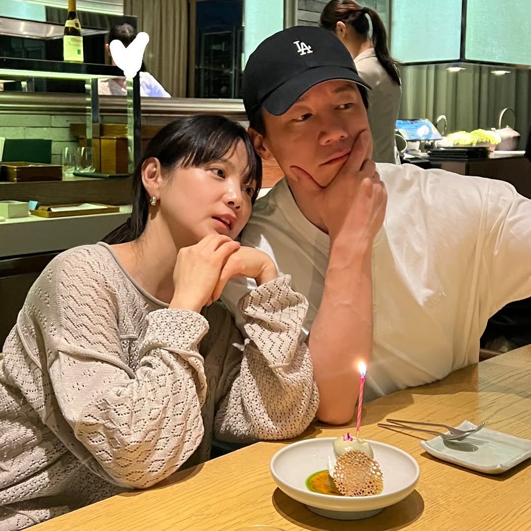 Photo shared by 윤승아 on April 13, 2026 tagging @m00ut. May be an image of one or more people, candle and text.