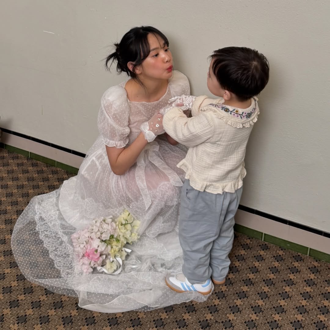 Photo shared by 윤승아 on March 28, 2026 tagging @pin_choy, @facilitiez, @kim_woohyun, @luckyyou55, @kangyewon, @eunnara82, @hong.eun_young, @kaylabennet_official, @m00ut, @45id_official, and @posyveil. May be an image of child, people kissing, baby's-breath, prairie gentian, wedding and text.