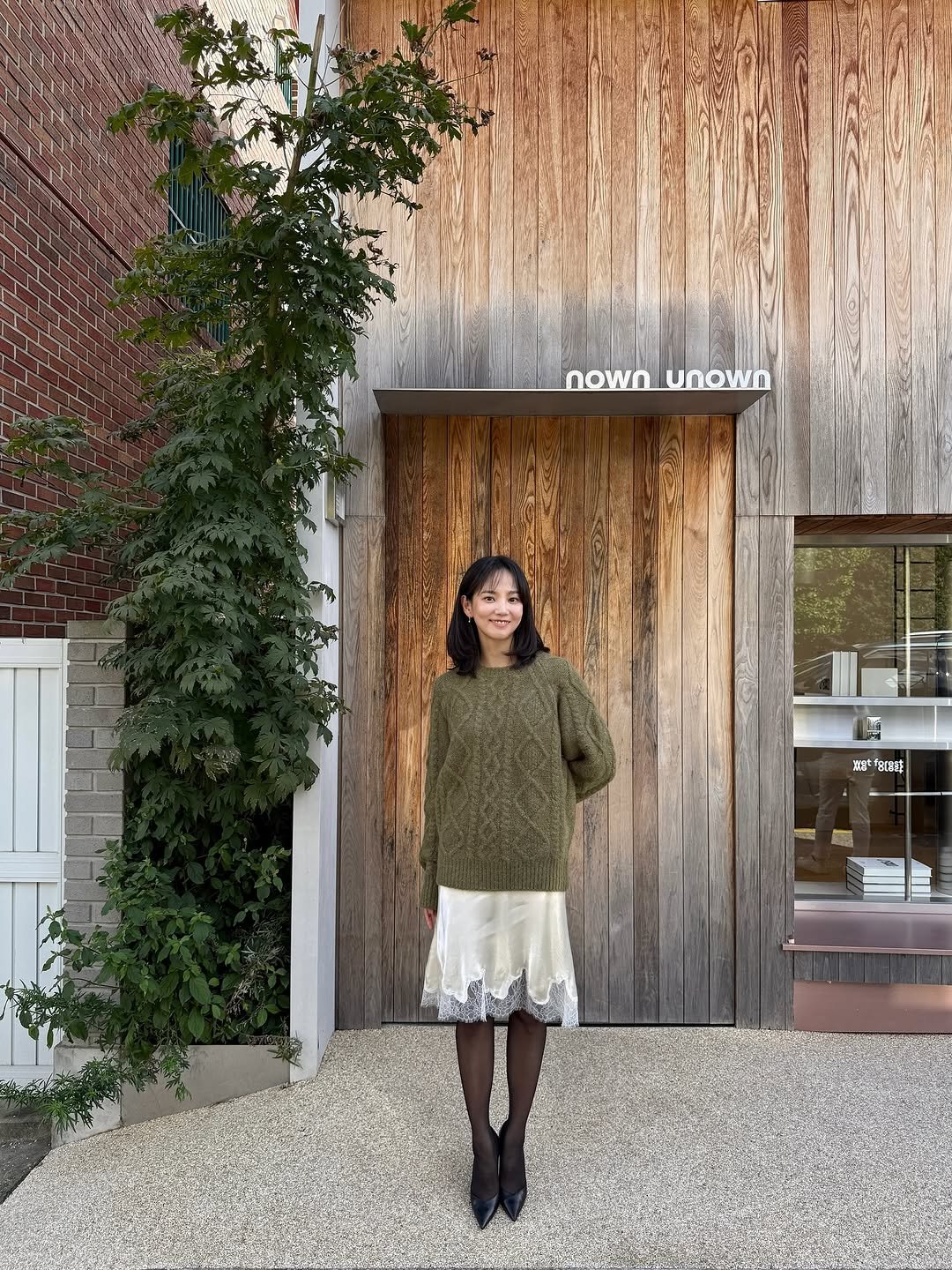 Photo shared by 윤승아 on October 27, 2025 tagging @nownunown. May be an image of cardigan, turtleneck and text.