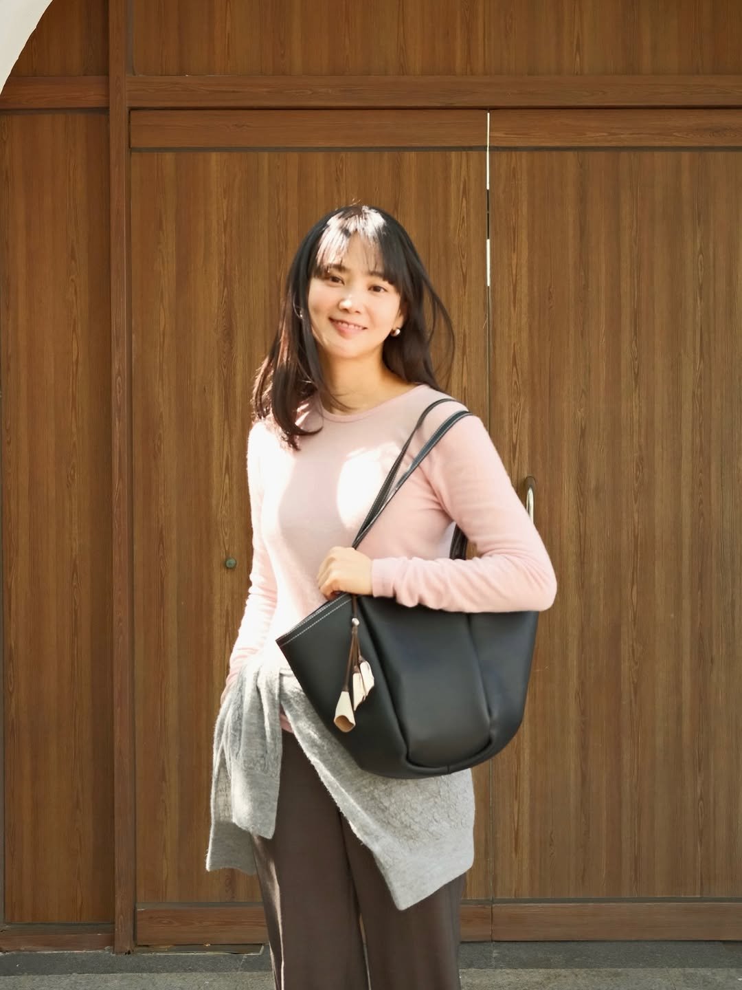 Photo shared by 윤승아 on April 14, 2026 tagging @eerep_official. May be an image of sling, purse and text.