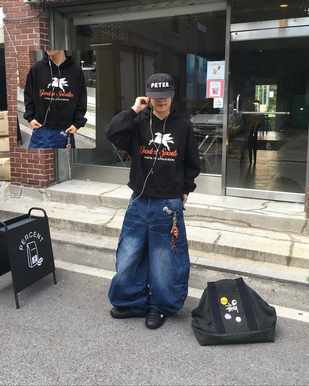 Photo shared by 투븐 / TOVN on November 12, 2025 tagging @tovn_official. May be an image of duffle coat, hat, parka, sportswear and text.