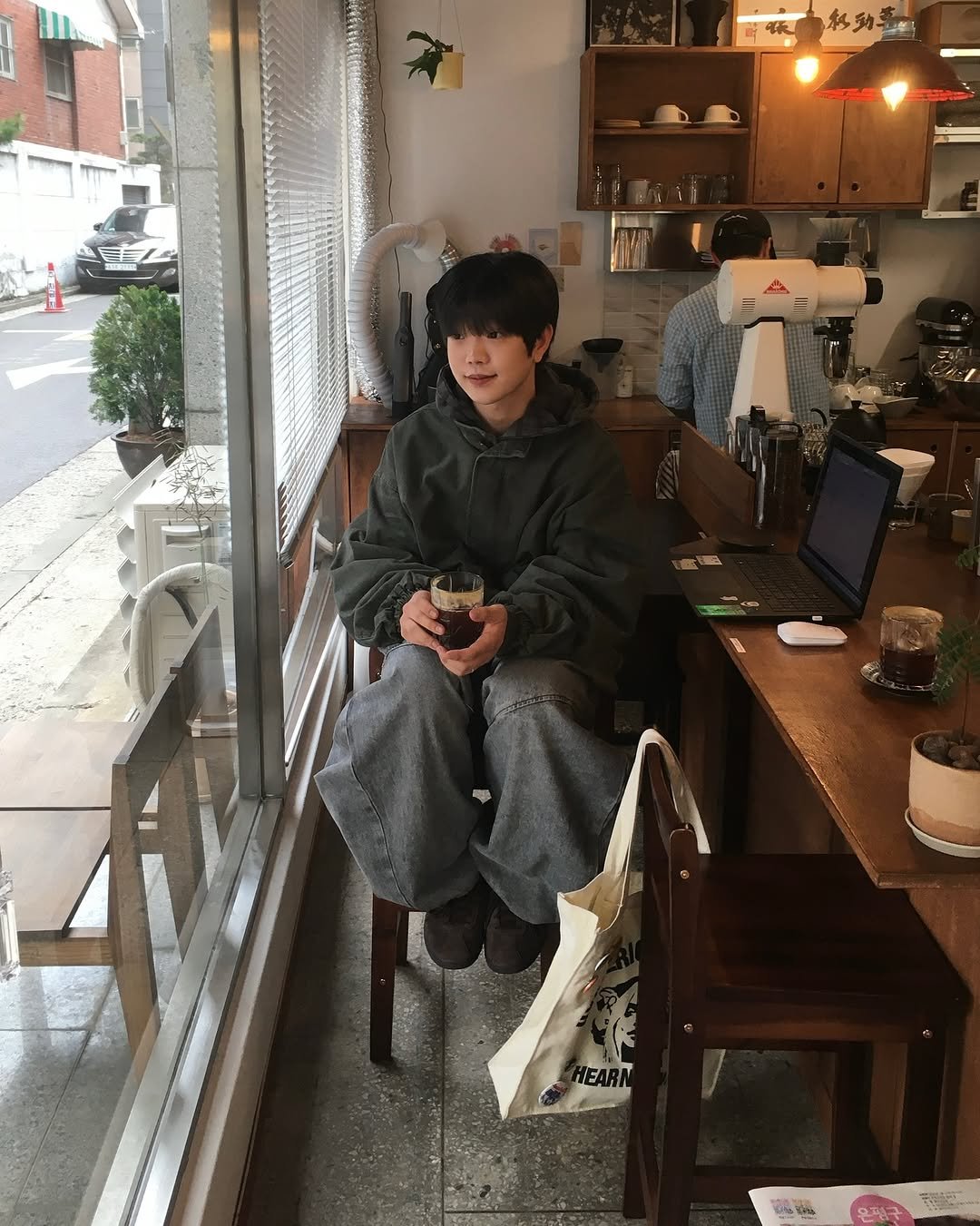 Photo shared by 투븐 / TOVN on November 11, 2025 tagging @tovn_official. May be an image of duffle coat, pot, cornflower and text that says '味'.