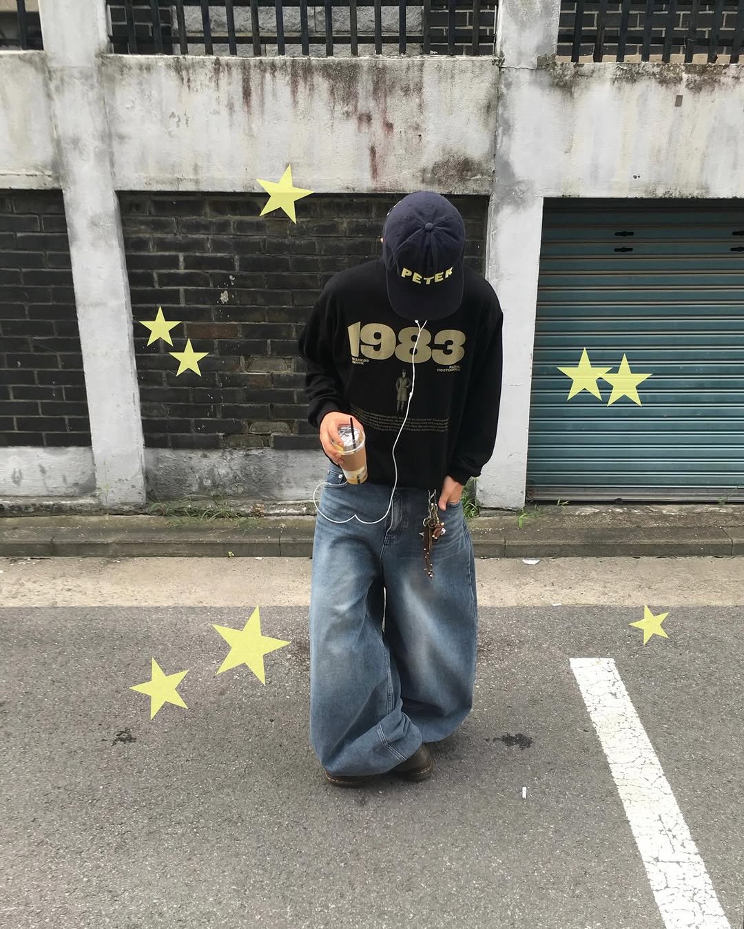 Photo shared by 동현 / 투븐 TOVN on September 17, 2025 tagging @tovn_official. May be an image of 1 person, face mask, parka, bandanna, sweatpants and text that says 'PETER PETEF'.