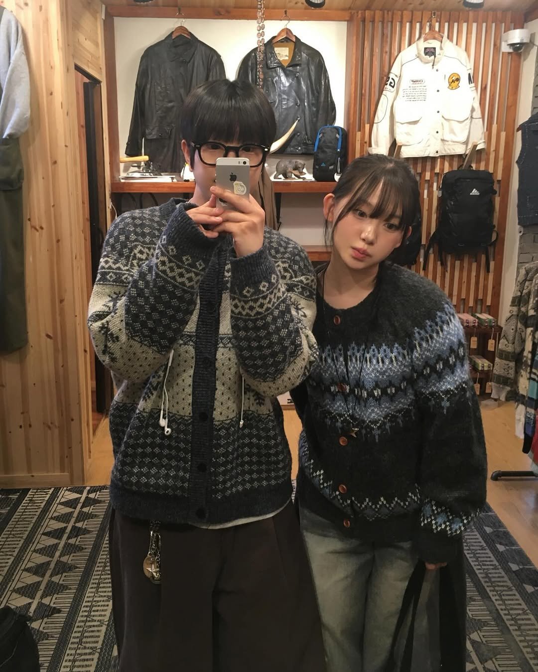 Photo shared by 투븐 / TOVN on December 24, 2025 tagging @suj_j_, and @tovn_official. May be an image of duffle coat, top, parka, sweater and text.