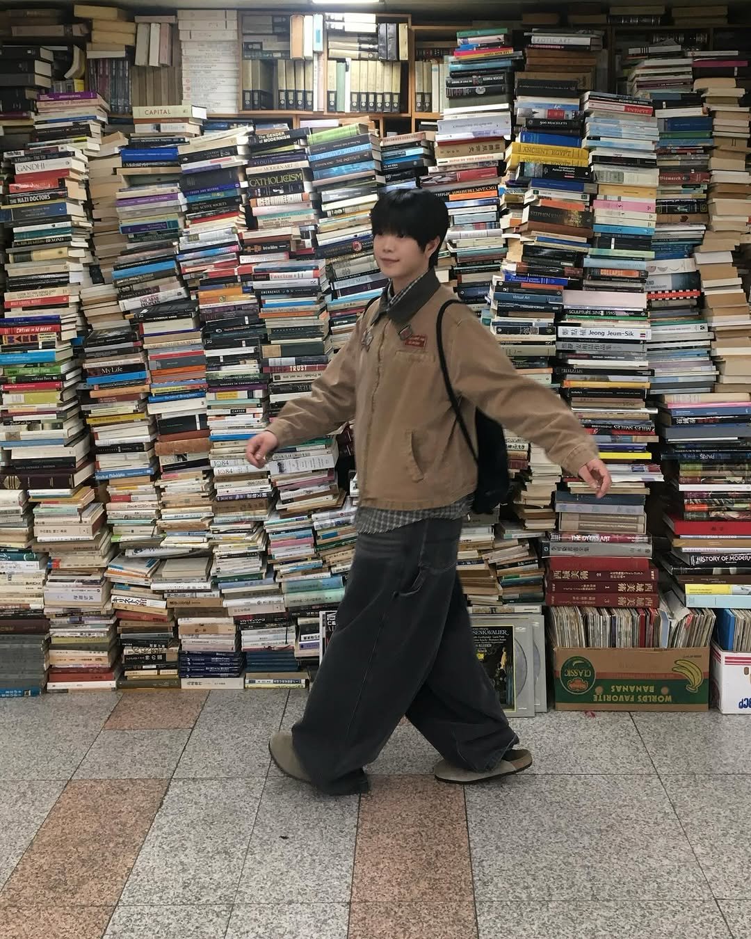 Photo shared by 동현 / 투븐 TOVN on September 24, 2025 tagging @tovn_official. May be an image of 1 person, book and text.