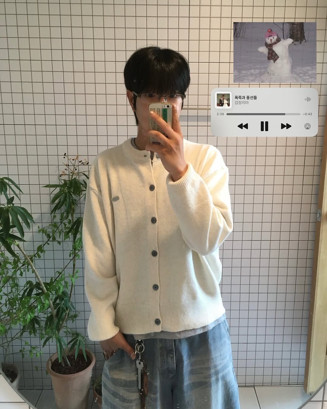 Photo shared by 투븐 / TOVN on December 08, 2025 tagging @tovn_official. May be an image of duffle coat, sweater, turtleneck, cardigan and text.