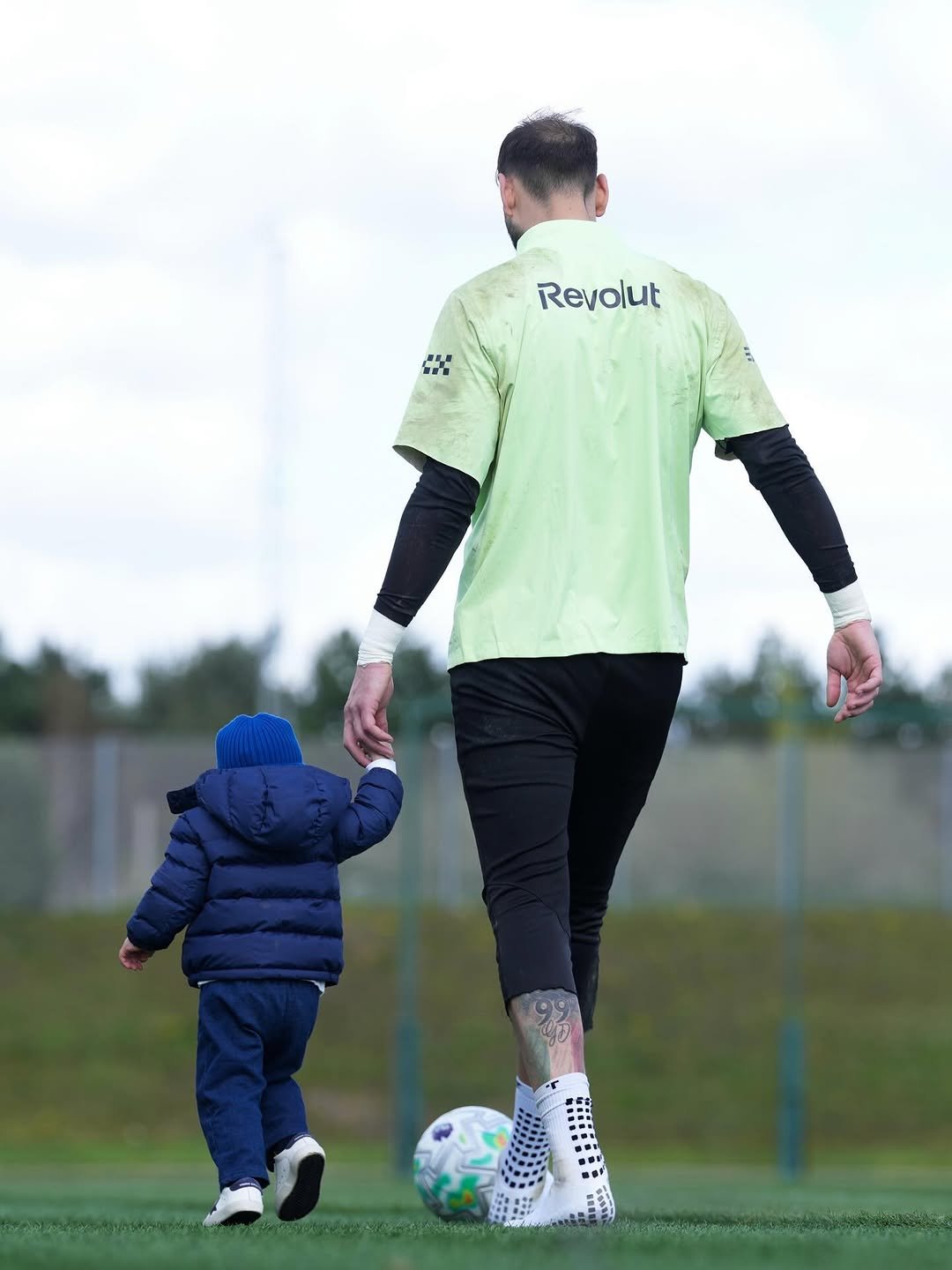 Photo by GIANLUIGI DONNARUMMA on April 13, 2026. May be an image of football, soccer, ball, sports equipment, stadium and text that says 'Revolut'.