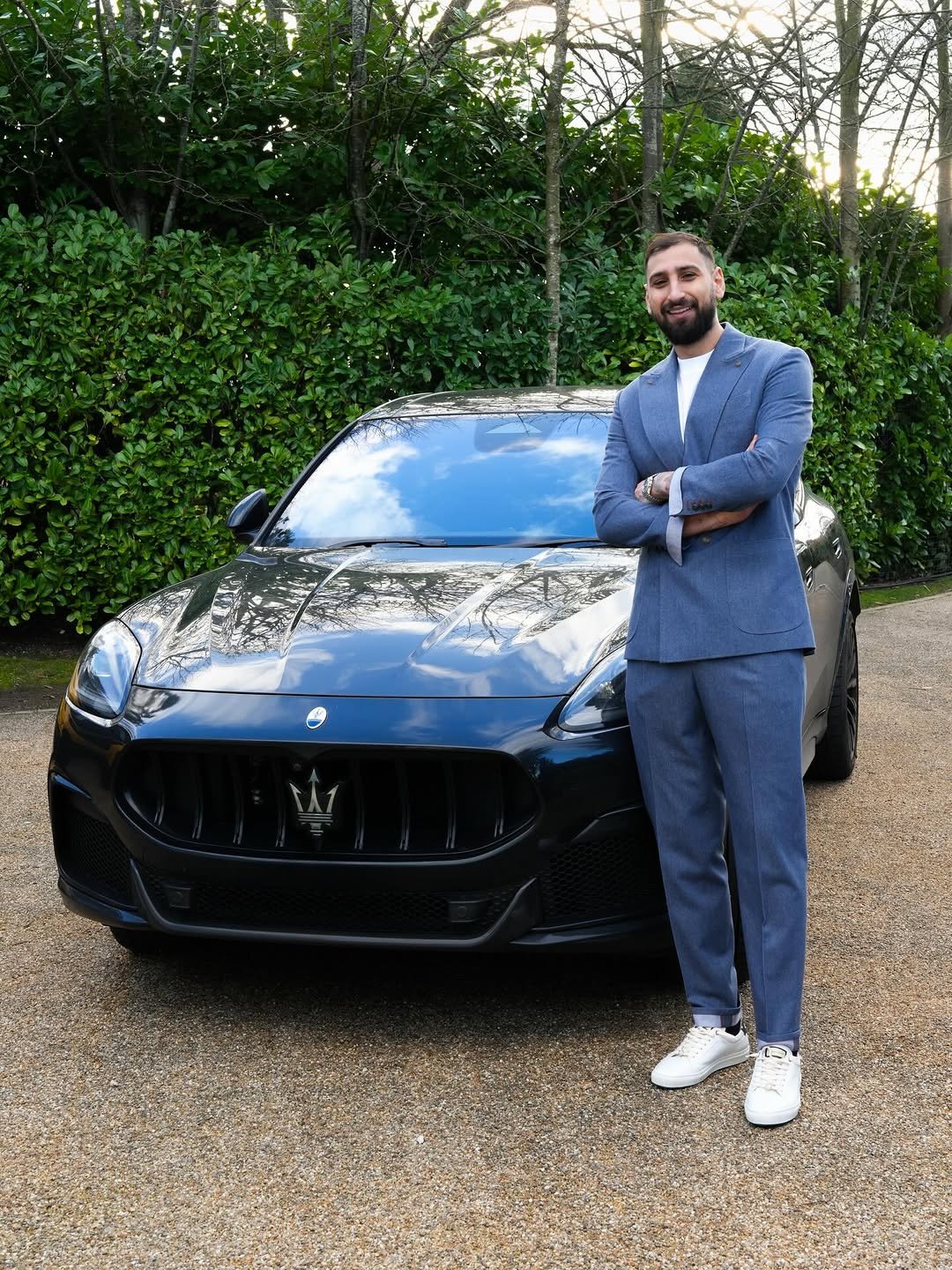 Photo shared by GIANLUIGI DONNARUMMA on January 15, 2026 tagging @maserati, and @arnoldclarkluxe. May be an image of car, suit, wheel, dinner jacket and text.