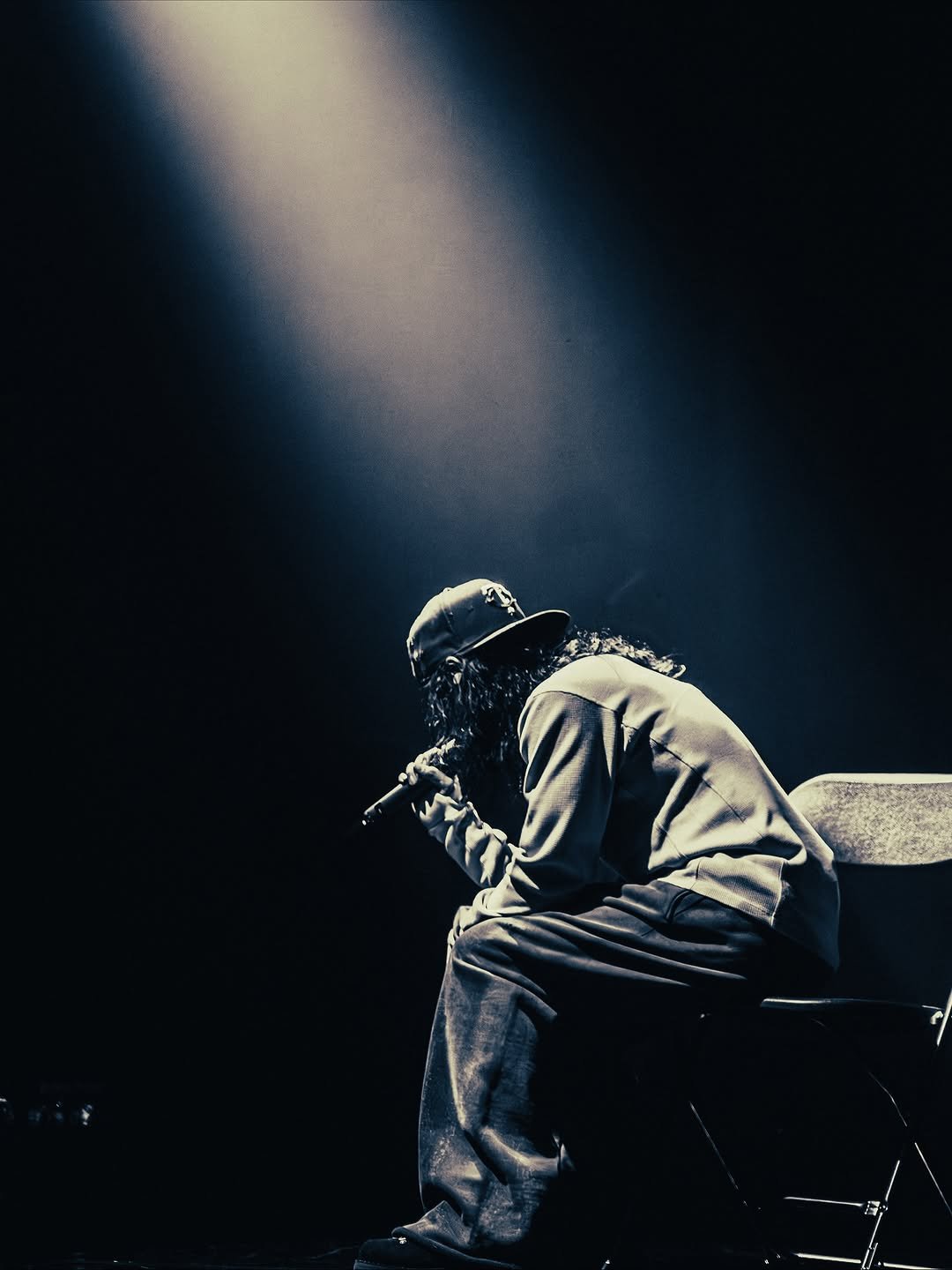 Photo shared by DND MAGAZINE on November 12, 2025 tagging @jiwonstein. May be an image of harmonica, microphone, concert and text.