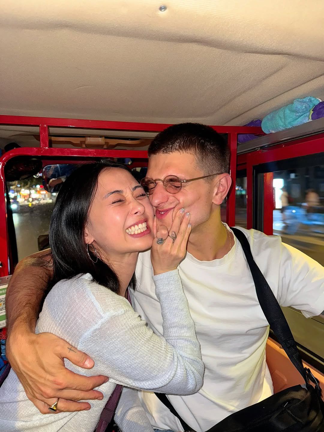 Photo by doobydobap on June 10, 2025. May be an image of one or more people, people kissing and bus.