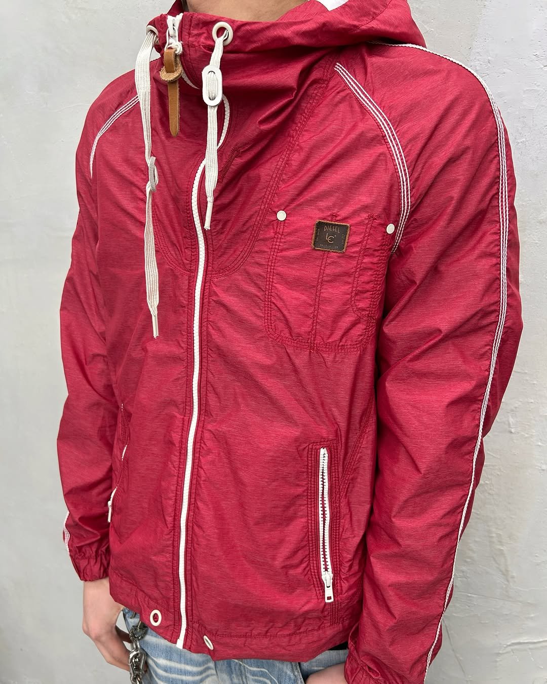 Photo by 도조 홍대 빈티지샵 on April 16, 2026. May be an image of fleece, jacket, raincoat, parka and text.