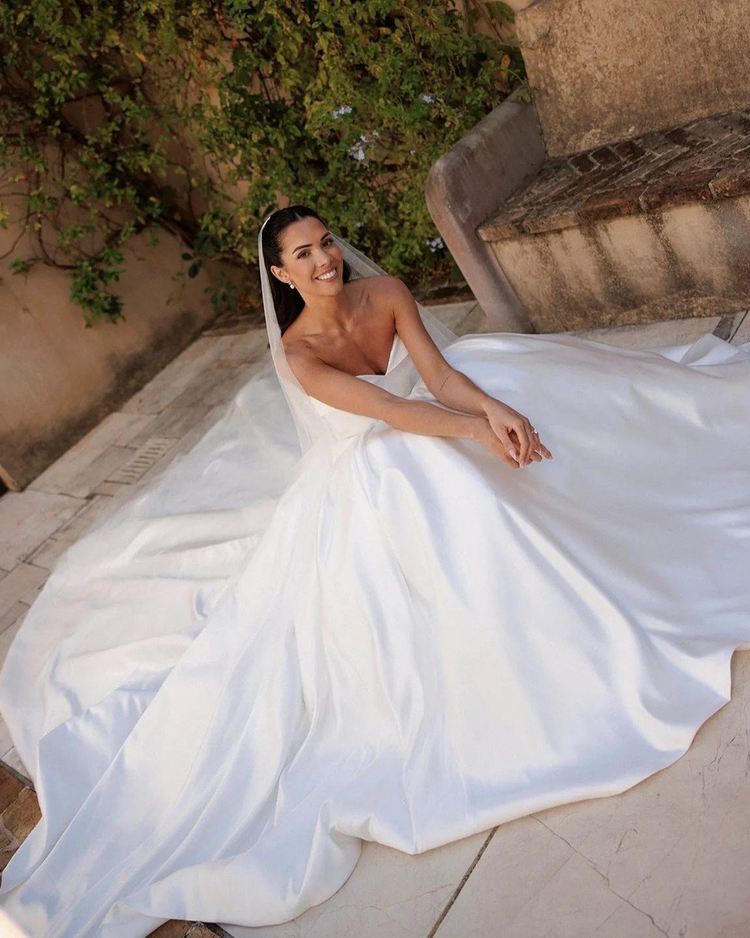 Photo shared by British Vogue on October 16, 2025 tagging @drhazelwallace. May be an image of gown, dress, wedding and text.