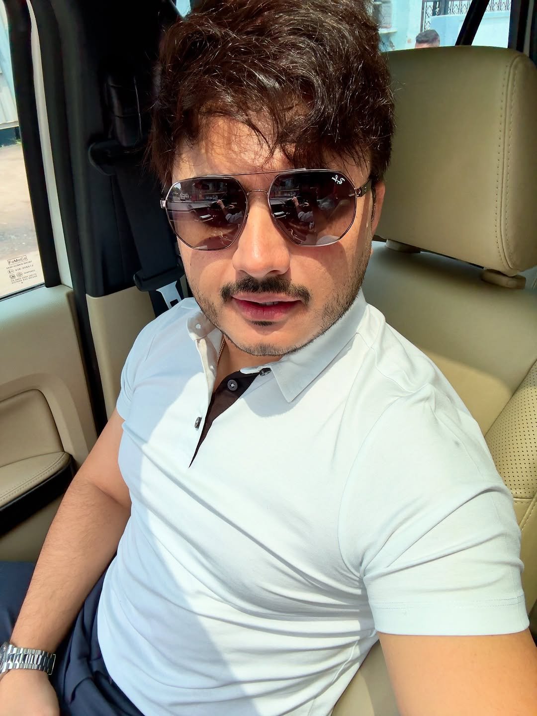 Photo by DR IMRAN S PATEL on August 18, 2025. May be a selfie of 1 person, beard, hair, sunglasses, seatbelt and text.