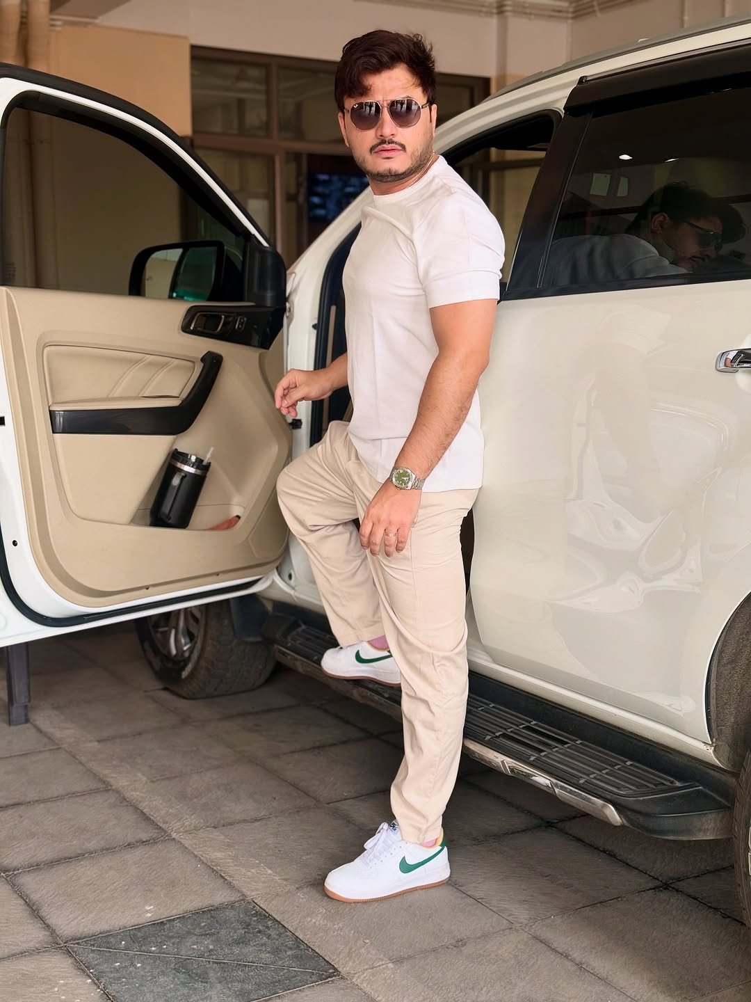 Photo by DR IMRAN S PATEL on August 13, 2025. May be an image of 2 people, car, wrist watch, wingtip shoes, jeep, sweatpants and text.