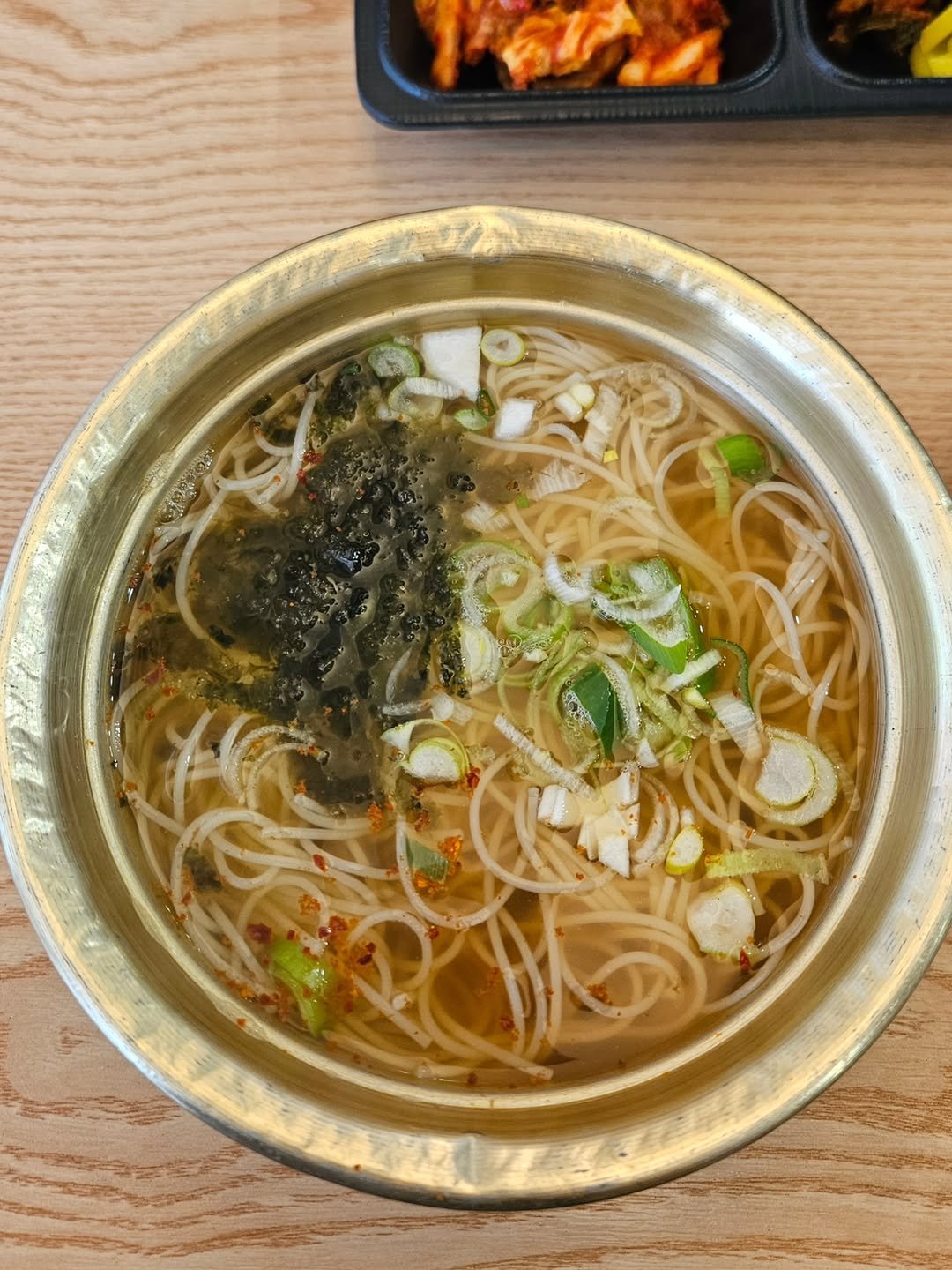 Photo by 카페 • 맛집 • 여행 리뷰 on March 06, 2026. May be an image of ramen, noodles, vegetable and text.