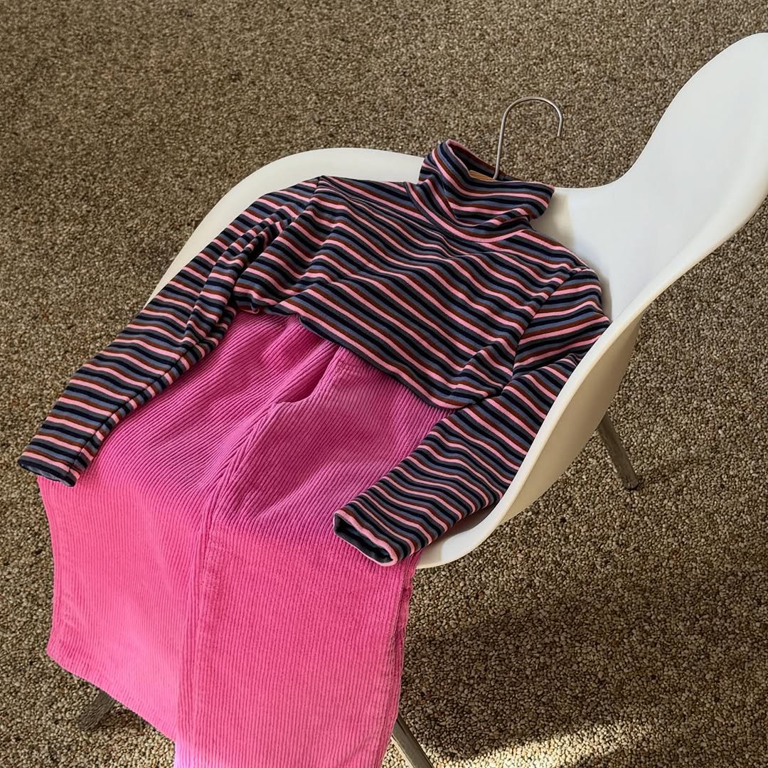 Photo by e t d _ 오땅뜨 on December 03, 2025. May be an image of sweater, stripes, knit, turtleneck and text.