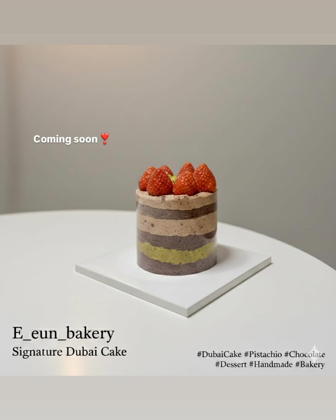 Photo by 이은베이커리 on January 30, 2026. May be an image of strawberry, chiffon cake, bread, fruitcake, pastry and text that says 'Coming soon E_eun_bakery E _bakery Signature Dubai Cake #DubaiCake #DubaiCake#Pistachio#Chocolate #Pistachio #Chocolate #Dessert #Handmade #Bakery'.