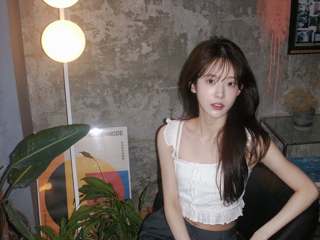 Photo by 루다 LUDA on August 16, 2025. May be an image of 1 person, hair, bra, top and text.
