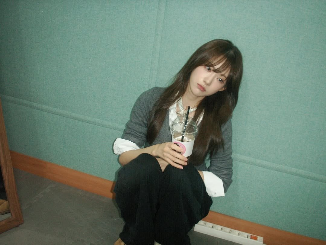 Photo by 루다 LUDA on November 21, 2025. May be an image of one or more people, bangs, top and text.