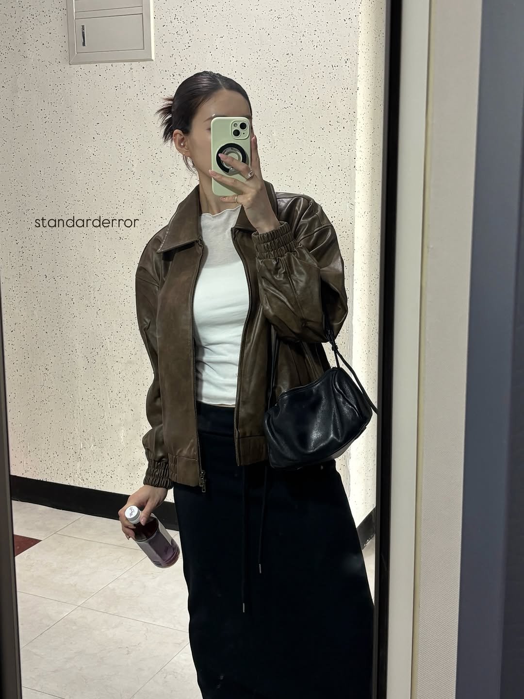 Photo shared by 이식로그🫧 on February 16, 2026 tagging @standarderror_official. May be an image of flight jacket, mirror, parka and text.