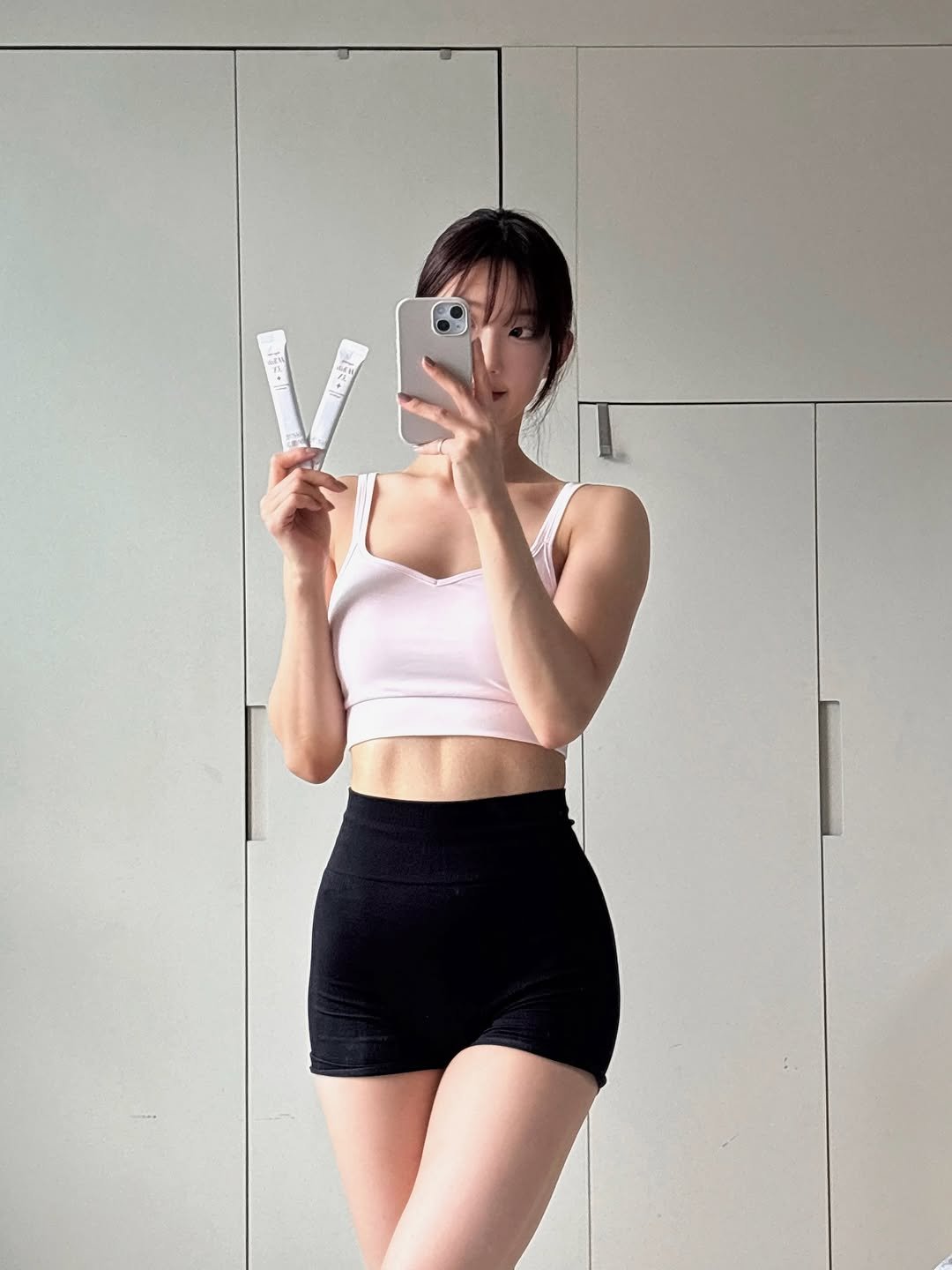 Photo shared by 이식로그🫧 on September 16, 2025 tagging @extreme.kr. May be an image of 1 person, activewear, tights, sportswear, shorts, bra and text.