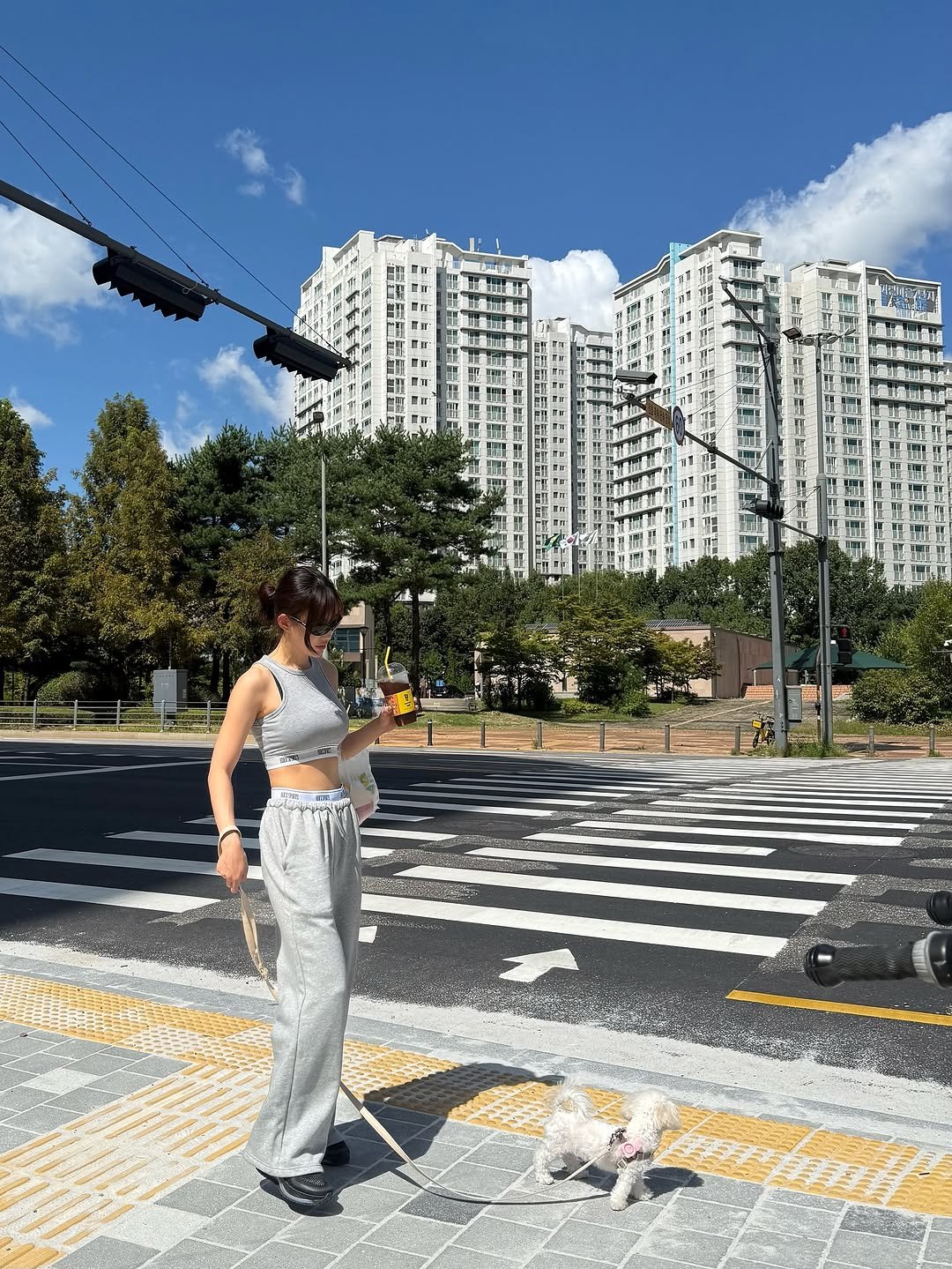 Photo shared by 이식로그🫧 on September 22, 2025 tagging @hdex__official, and @hdex_women. May be an image of 1 person, road, street and text.