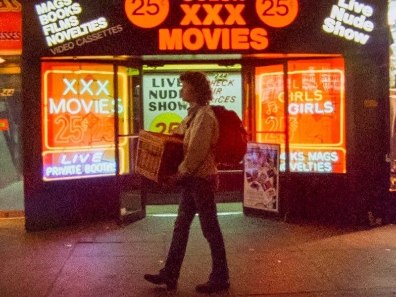 Photo by Echo in Eco on October 30, 2025. May be an image of Times Square, street and text that says 'KE MAAKS BOOS FILMS CASSETTES 25 25 ROVETTES NOVELTIES NOVEL-SSETTE SDEO MOVIES 232 ECK VR ICES LIVE NUD SHOW 2র 中肉田 IRLS GIRLS ね XXX MOVIE: 25 LIVE PRIVATE PRIVATEBQ0I 8อ0โล KS MAGS VELTIES'.