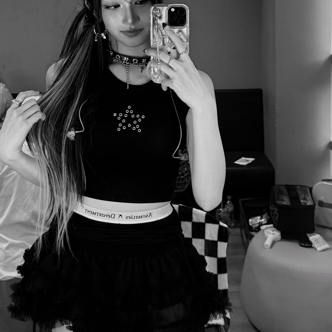 Photo by 이서 LEESEO on September 13, 2025. May be a black-and-white image of 1 person, braids and phone.