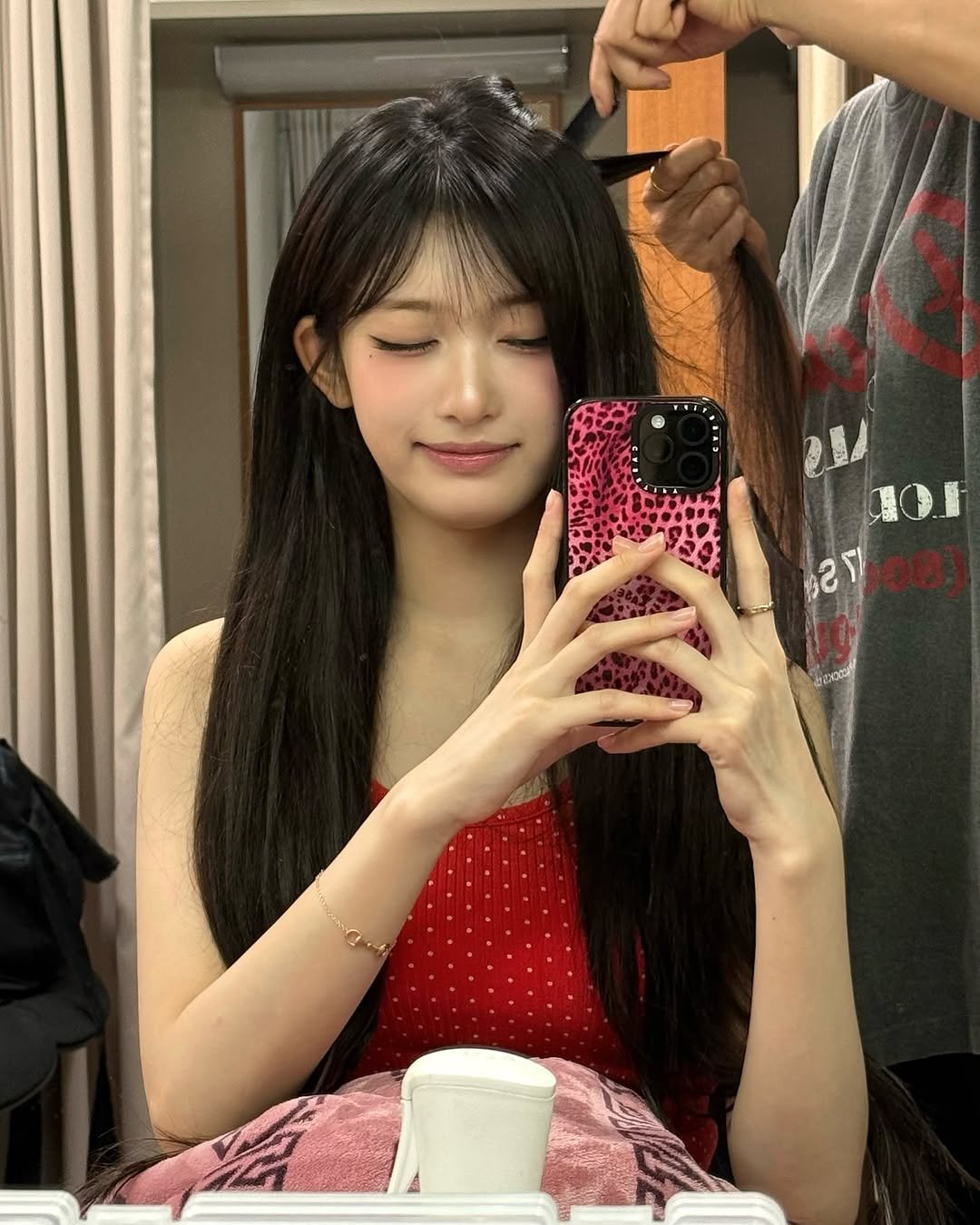 Photo by 이서 LEESEO on September 27, 2025. May be an image of 1 person, braids, bangs and hair brush.