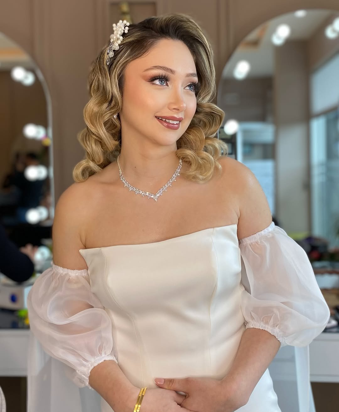 Photo by Nazlı Akköse on April 14, 2026. May be an image of one or more people, braids, makeup, dress and text.