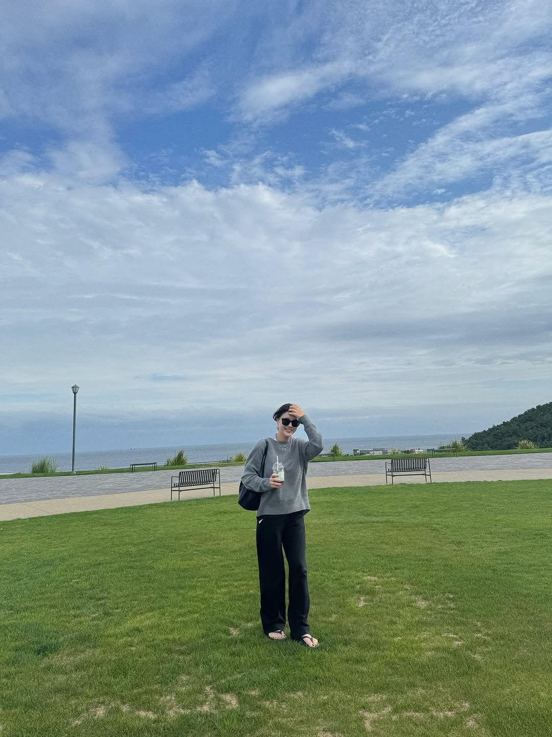 Photo by 박은지 on September 23, 2025. May be an image of 1 person, ocean, grass and text.