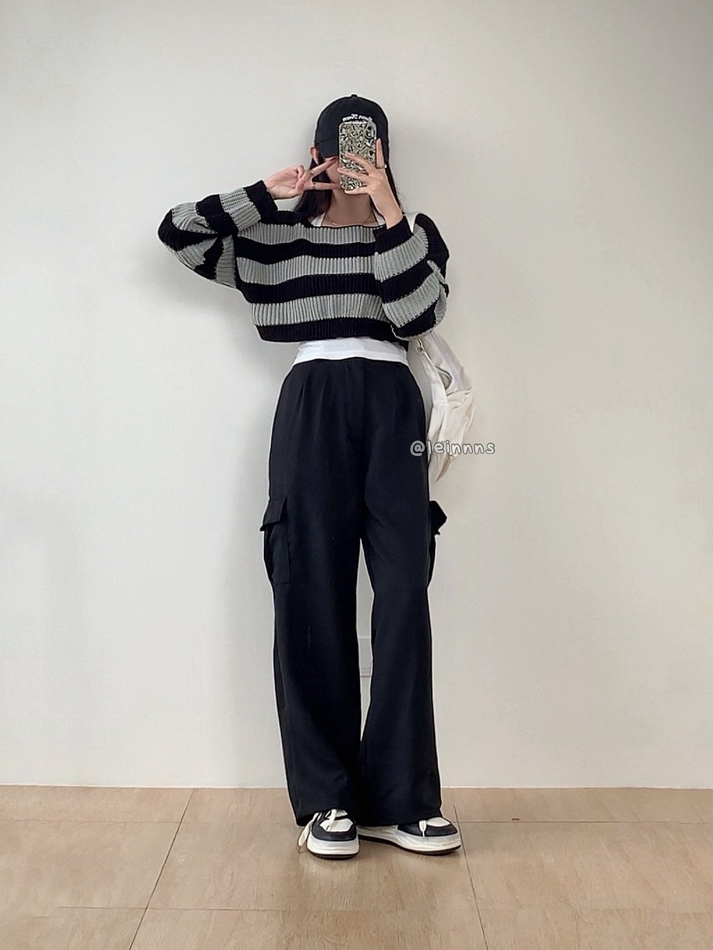 Photo by Elaine Alethea / Leinnns on September 30, 2025. May be an image of 1 person, sweatpants, stripes, top and text.
