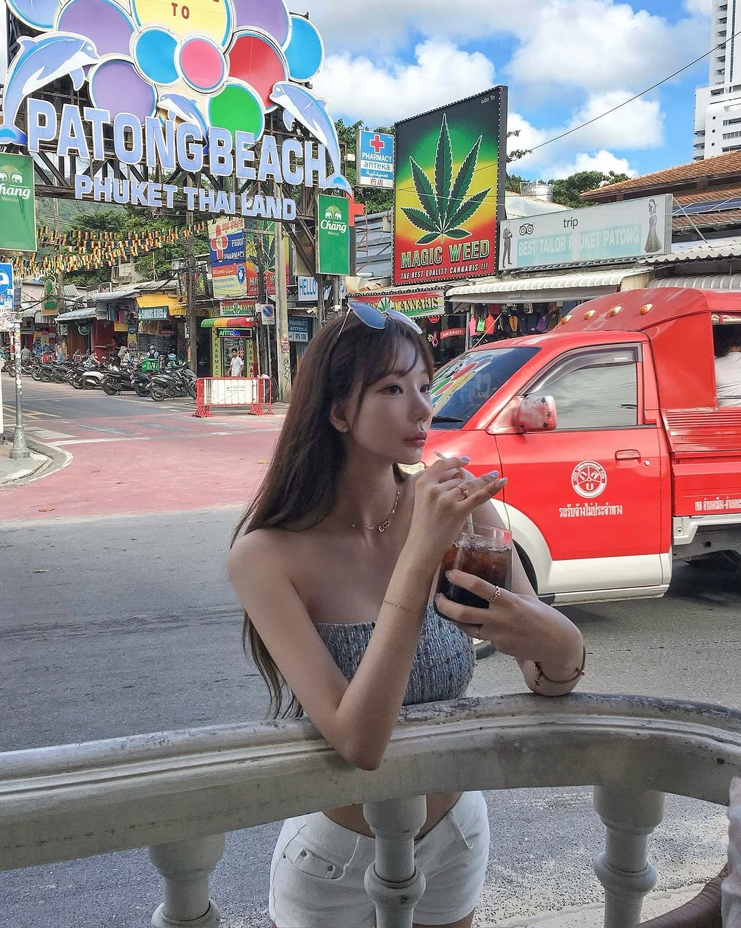 Photo shared by 엘르핏 | 여성의류 • 키큰여자쇼핑몰 on August 07, 2025 tagging @zeroclinic_official. May be an image of 1 person, smoking, cigarette, signboard, street and text.