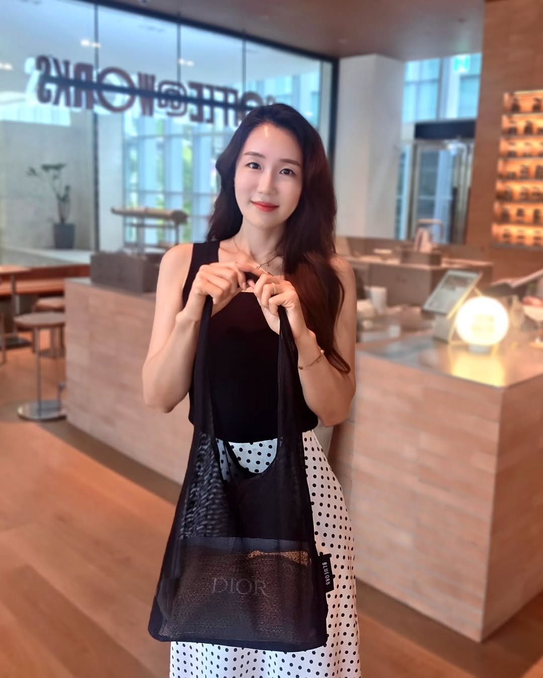 Photo shared by 혜령..⭐️ on September 29, 2025 tagging @styler_mag. May be an image of 1 person, sling, purse, cornflower and text.