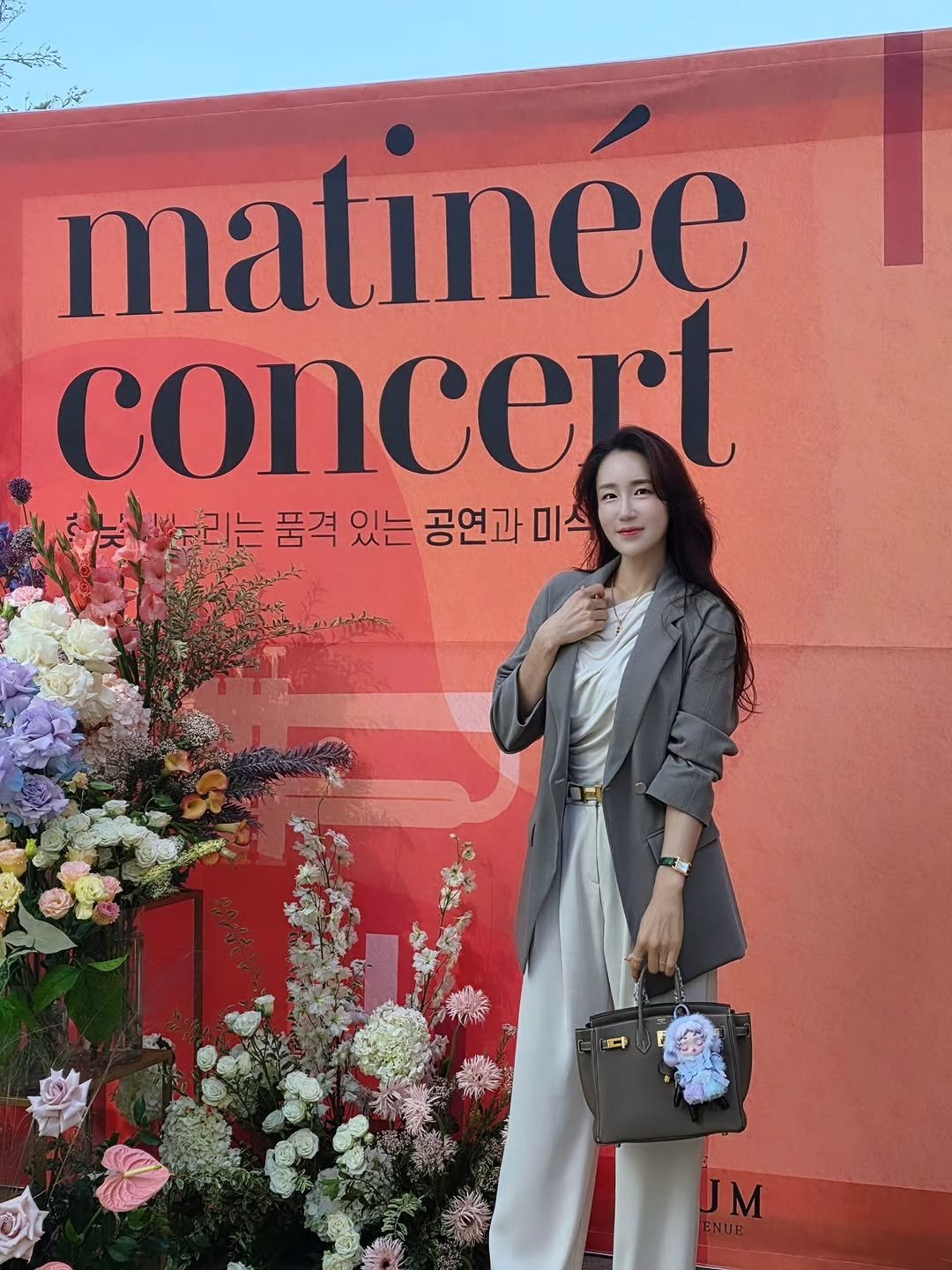 Photo shared by 혜령..⭐️ on October 28, 2025 tagging @_woojung_lee, and @starintv_ent. May be an image of overcoat, blazer, suit and text that says 'matinee concert 누리는 는 품격 있는 공연과 미스 UM'.