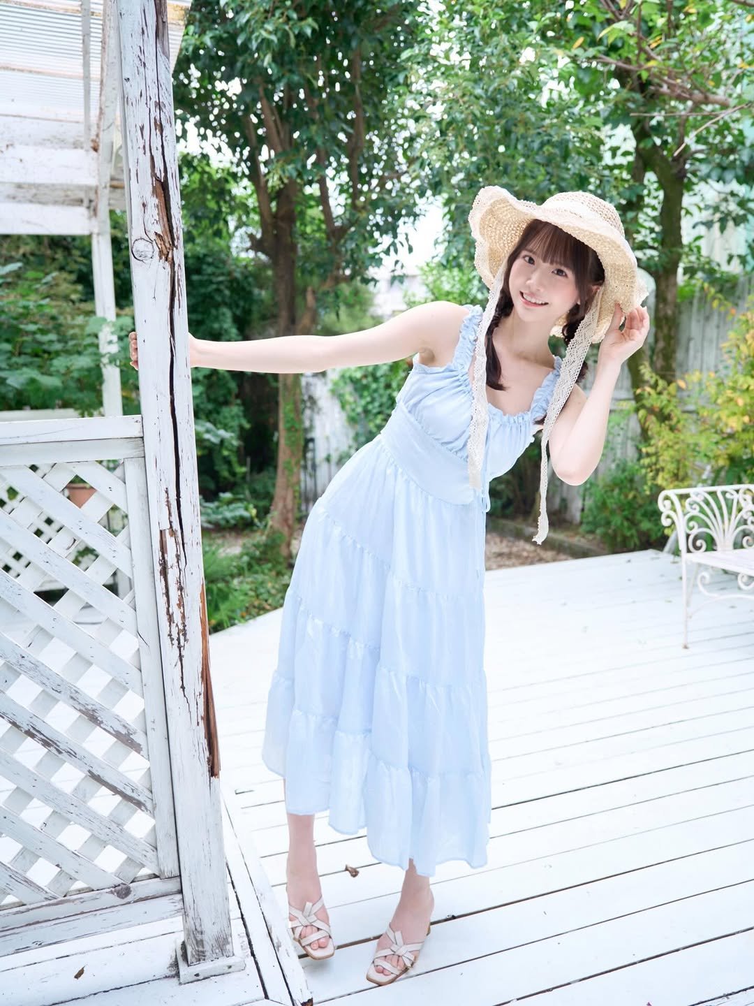 Photo by 白上咲花 on April 15, 2026. May be an image of hat, parasol, dress, sundress and text.